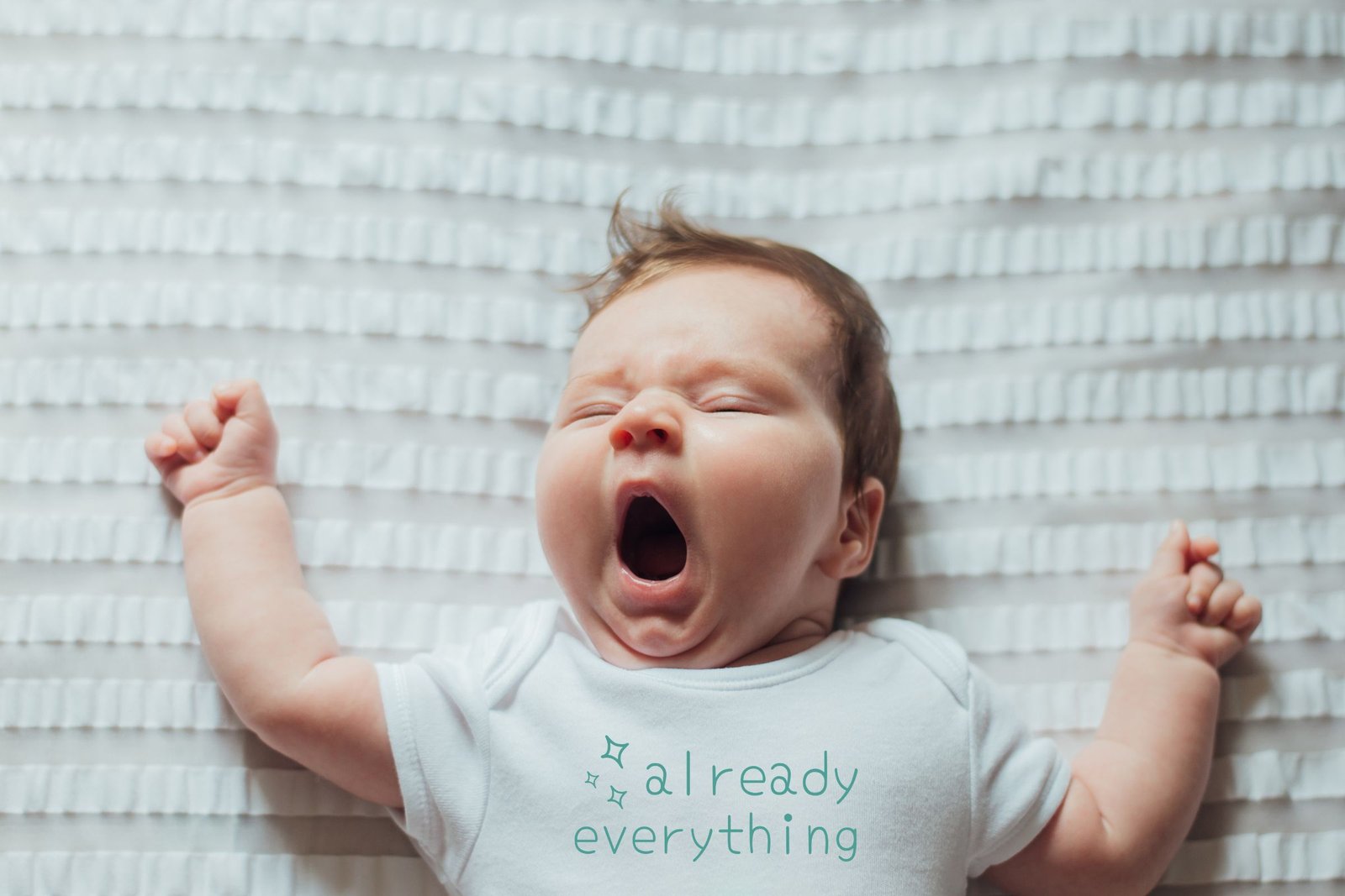 Our Ethics Yawning baby in Airlume 100 cotton baby bodysuit with "already everything" slogan by Little Guru & Co.