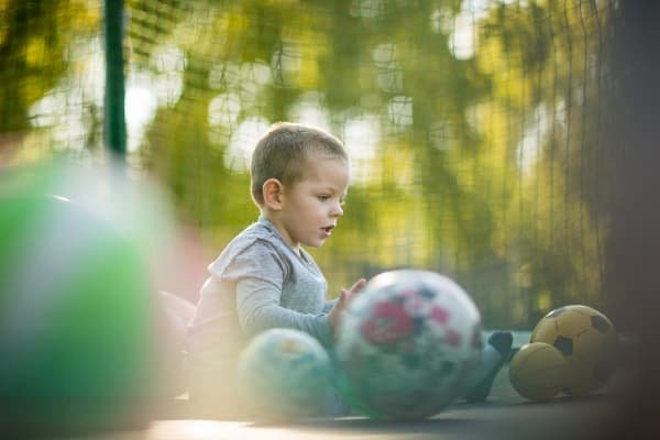 The Gifts Hidden in Our Shadow: Parenting, Healing & the Parts Our Children Reflect Young child exploring and playing independently representing curiosity, confidence, and emotional development in conscious parenting.