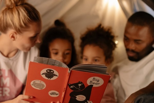 How Our Children Help Us Reparent Ourselves | Conscious Parenting & Healing Family reading together in a cozy space symbolizing emotional connection, mindful parenting, and childhood safety.
