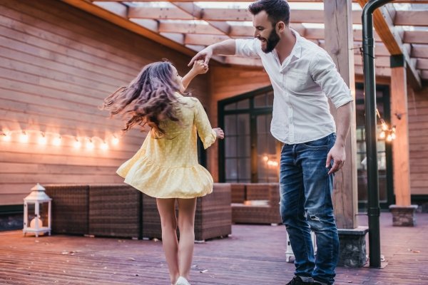 How Our Children Help Us Reparent Ourselves | Conscious Parenting & Healing Father dancing with daughter outdoors symbolizing joyful parenting, healing childhood wounds, and emotional presence.