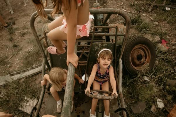The Gifts Hidden in Our Shadow: Parenting, Healing & the Parts Our Children Reflect Children playing freely outdoors representing creativity, freedom, and authentic self-expression in conscious parenting.