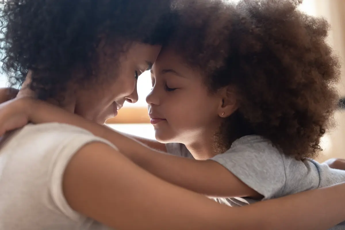 Mother and child embracing, illustrating healing the inner child through parenting and conscious motherhood.