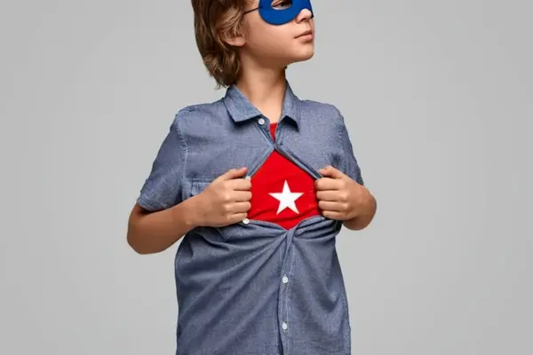 Are Humans Made of Stardust? The Science & Soul Explained Child dressed as a superhero with a star on his shirt, symbolizing our connection to the stars.