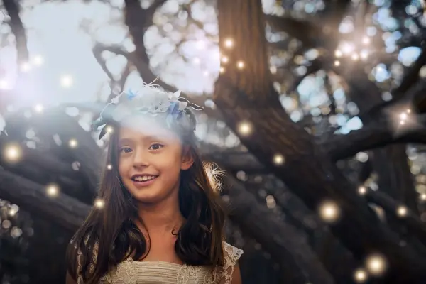 Are Humans Made of Stardust? The Science & Soul Explained Young child surrounded by glowing lights, evoking childhood wonder and our connection to the stars.